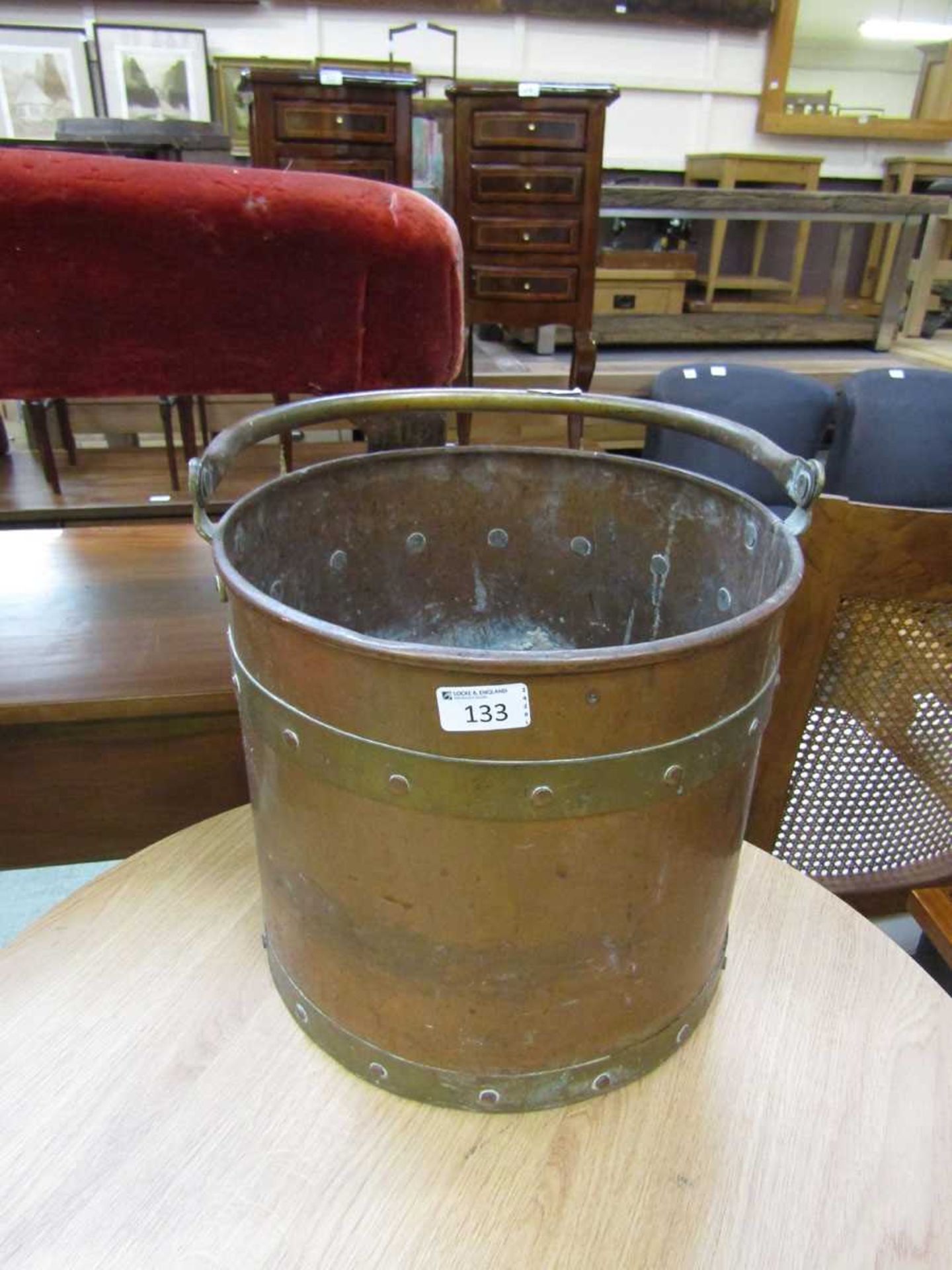 A brass and copper banded coal bucket
