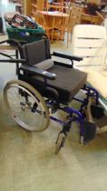 A blue tubular Action 2000 wheelchair