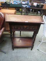 A mid-20th century oak hall table with carving to top approx 76cm