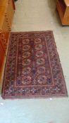 A brown and red rectangular eastern style rug