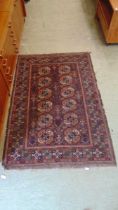 A brown and red rectangular eastern style rug