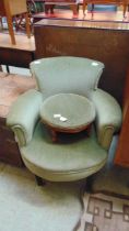 A late Victorian style tub chair upholstered in an olive green draylon fabric together with a