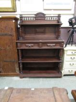 A late 19th century/early 20th century French oak buffet having a raised top section, the base