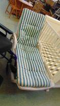 A white PVC garden lounger with a green striped cushion approx 98cm