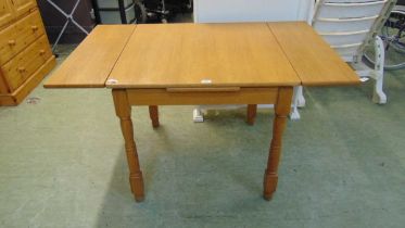 A reproduction oak veneered drawer leaf table approx 75cm