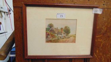 A framed and glazed watercolour of cottage scene approx 25cm x 32cm