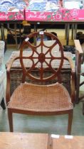 A late 19th century walnut open armchair with circular back and bergere seat backrest approx 94cm