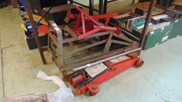 A pair of metalwork axle stands together with ramps and a trolley jack