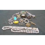 A bag containing early 20th century brooches, necklaces, etc