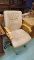 A reproduction tan leather chrome supported swivel executive chair backrest aprox 100cm