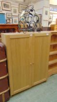 An oak effect laminated two door cupboard approx 107cm