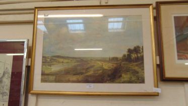 A framed and glazed print of countryside