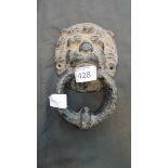 A Victorian cast iron door knocker in the form of lion