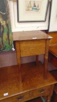 A mid-20th century oak sewing box supported on square legs approx 52cm