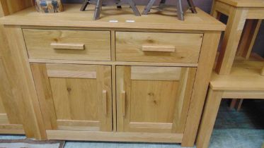 A modern oak effect dresser base having two drawers above two cupboard doors approx 82cm