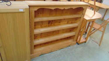 A low level reproduction waxed pine bookcase approx 109cm