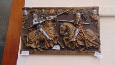 A relief moulded plaque by Marcus Designs