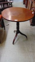 A 19th century oak tilt top table