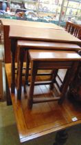 A nest of three mid-20th century oak occasional tables