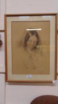 A framed and glazed 19th century pencil drawing of young girl, signed bottom right