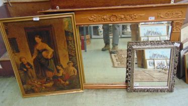 A gilt painted mirror together with a reproduction silvered framed ornate mirror and a framed