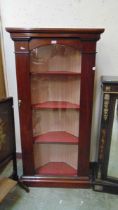 A Victorian mahogany veneered glazed corner cabinet