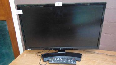 An LG TV with remote