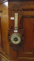 A mid-20th century arts and crafts style banjo barometer