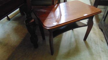 A mid-20th century oak occasional table with under tier