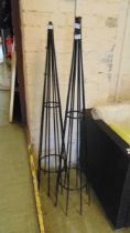 Two metal garden obelisks