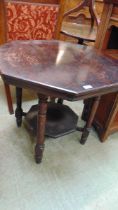 An Edwardian walnut octagonal occasional table with under tier