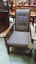 An early 20th century bobbin turned oak adjustable chair with bergere sides, with reupholstered