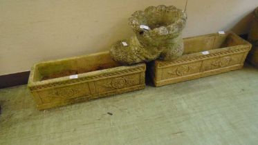 A pair of weathered rectangular garden planters together with a weathered stoneware garden planter