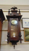 An early 20th century walnut Vienna wall clock