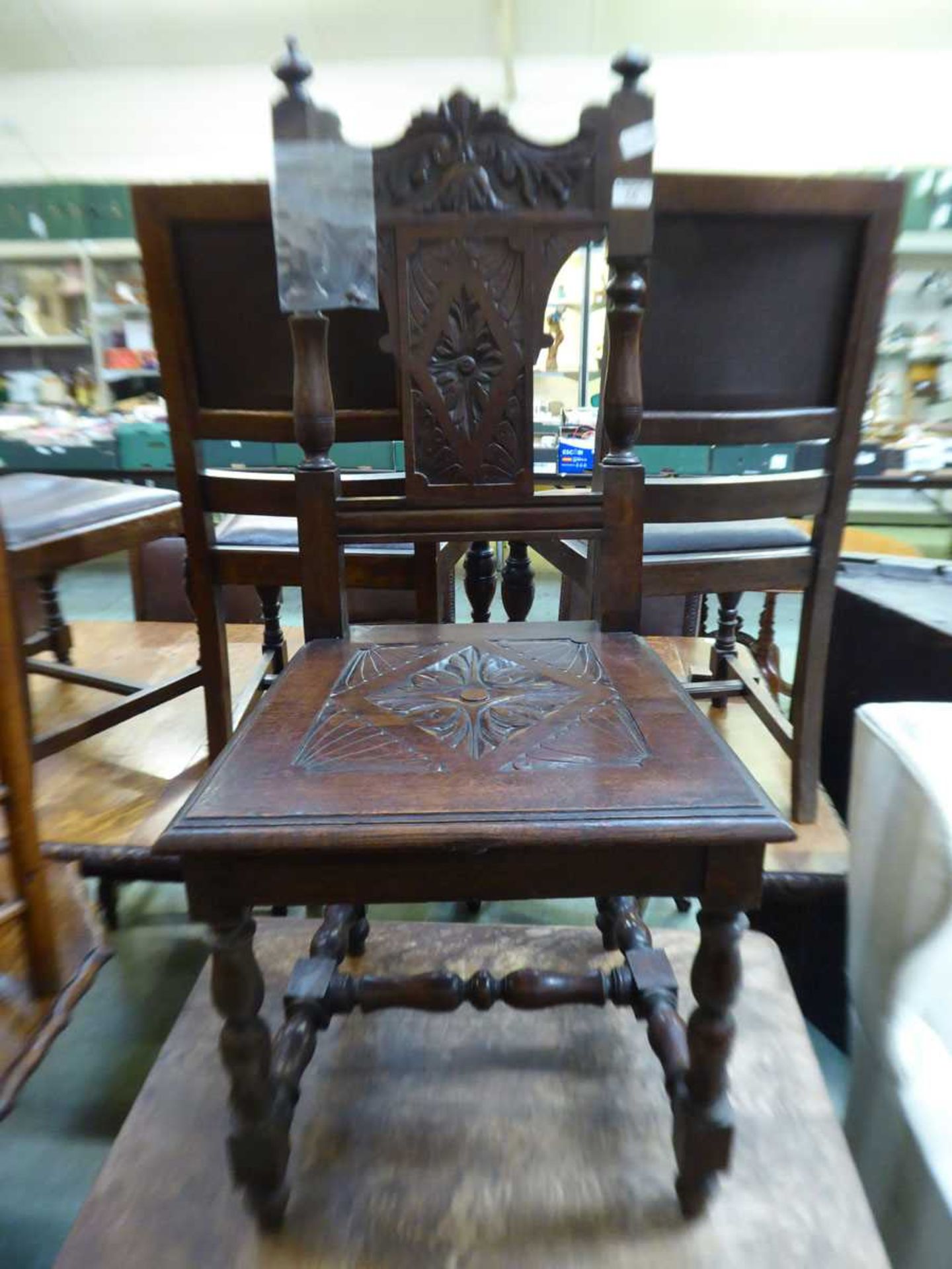 An early 20th century mahogany carved hall chair