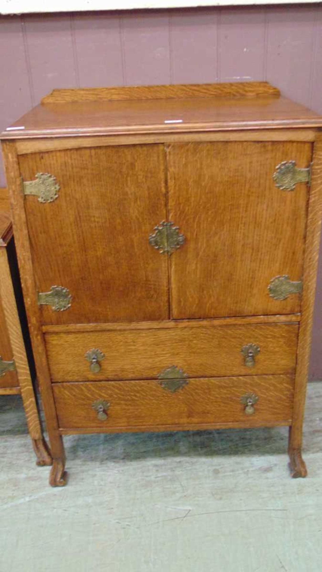 1940's oak gents wardrobe having two cupboard doors above two drawers