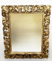 FLORENTINE WALL MIRROR, 19th century Italian Florentine carved giltwood cushion pierced frame and
