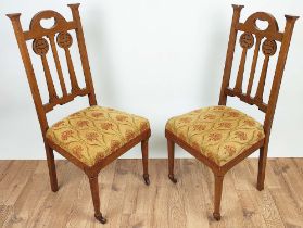 ARTS AND CRAFTS SIDE CHAIRS, a pair, circa 1905 oak the back-splats with carved roundels,