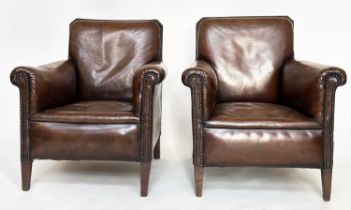 ARMCHAIRS, a pair, early 20th century French with brass studded mid brown natural hide leather and