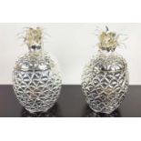 ICE BUCKETS, a pair, in the form of pineapples, polished metal, 33cm H each approx. (2)