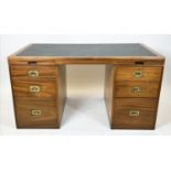 WARING & GILLOW CAMPAIGN STYLE PEDESTAL DESK, mahogany with six drawers, two brushing slides and