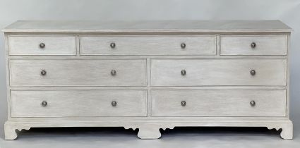 LOW CHEST, Georgian style grey painted with seven drawers and bracket supports, 180cm x 47cm D x