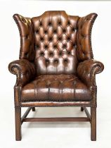 WING ARMCHAIR, George III design mahogany with deep buttoned, nicely aged, mid brown tan hide
