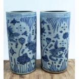 STICK STANDS, 60cm high, 28cm diameter, a pair, Chinese export style blue and white ceramic. (2)