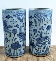 STICK STANDS, 60cm high, 28cm diameter, a pair, Chinese export style blue and white ceramic. (2)