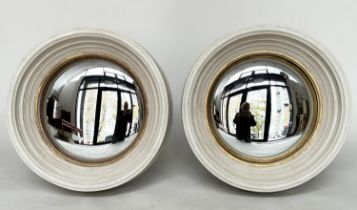 WALL MIRRORS, a pair, Regency style with convex mirror plates, gilt slips and deeply moulded frames,