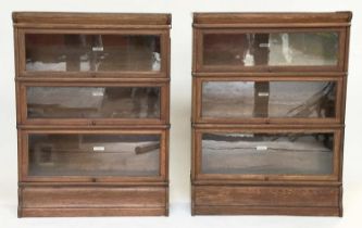 GLOBE WERNICKE BOOKCASES, a pair, early 20th century oak each with three glazed stacking sections,