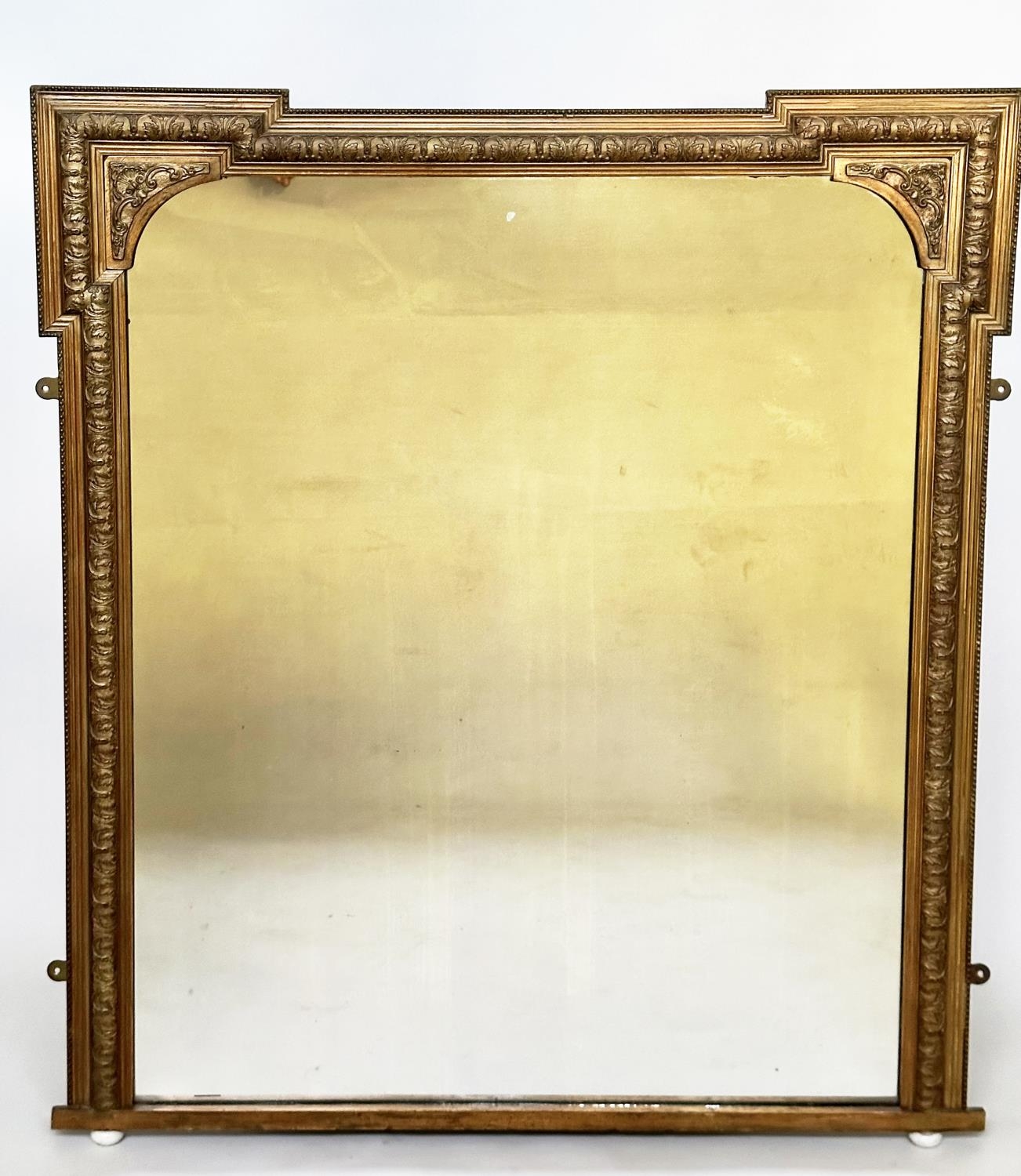 OVERMANTEL MIRROR, late 19th century giltwood and composition rectangular with arched and beaded