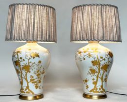 TABLE LAMPS, a pair, Chinese ceramic vase form, white with fine gilded trailing shrub decoration (