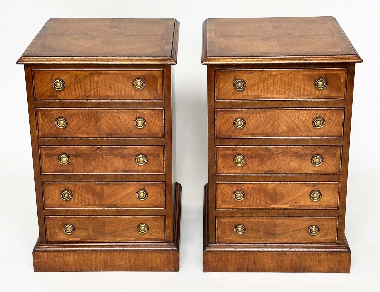 BEDSIDE CHESTS, a pair, George III design figured walnut and crossbanded, each with four drawers,